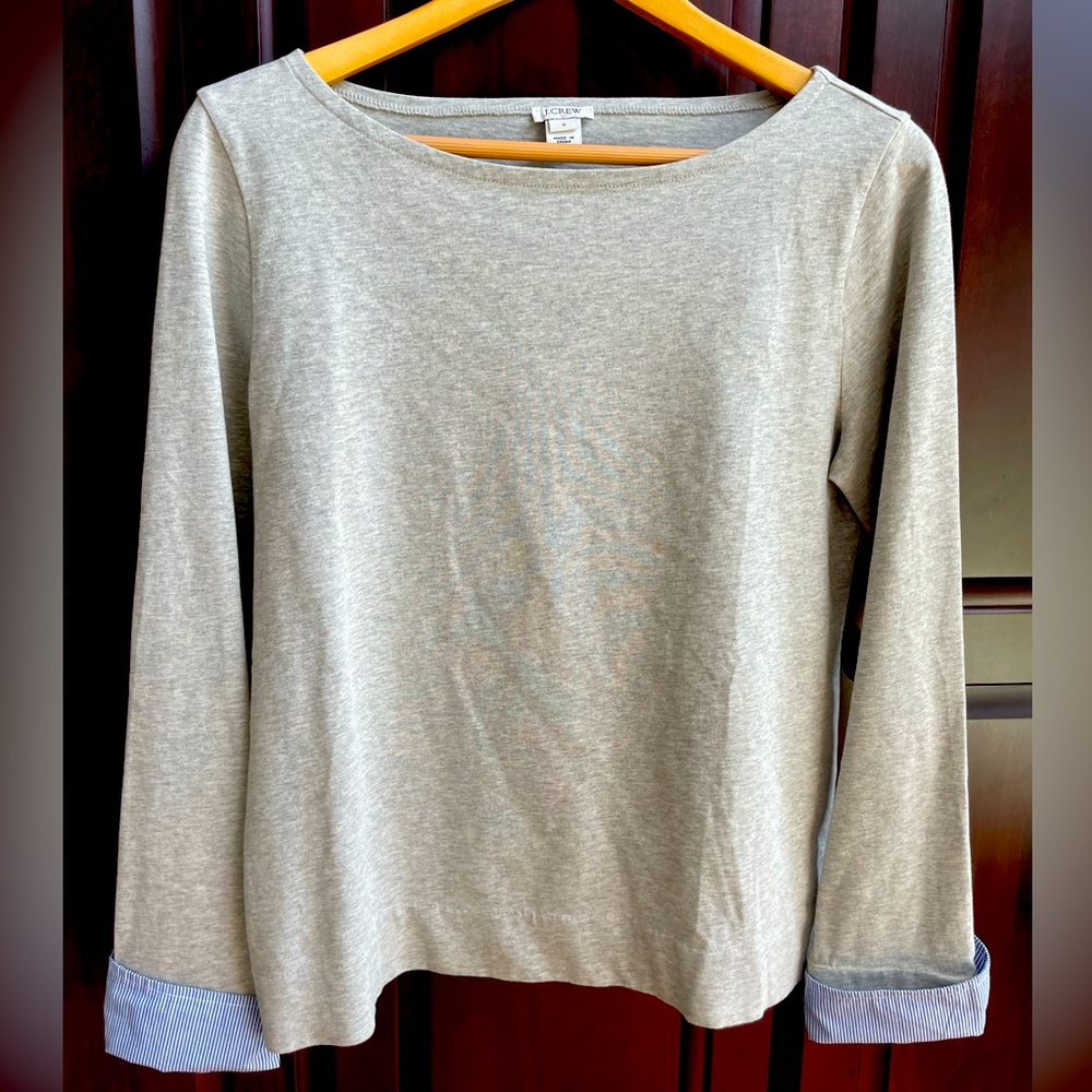 J. Crew casual Grey top with Oxford blue sleeve accent. Gently used.Size Small.